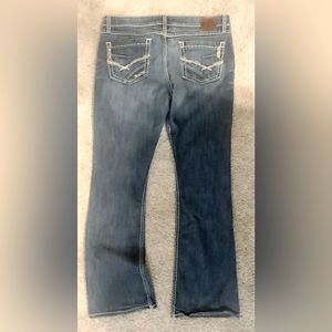 BKE Women’s mid-rise, boot cut jean.
